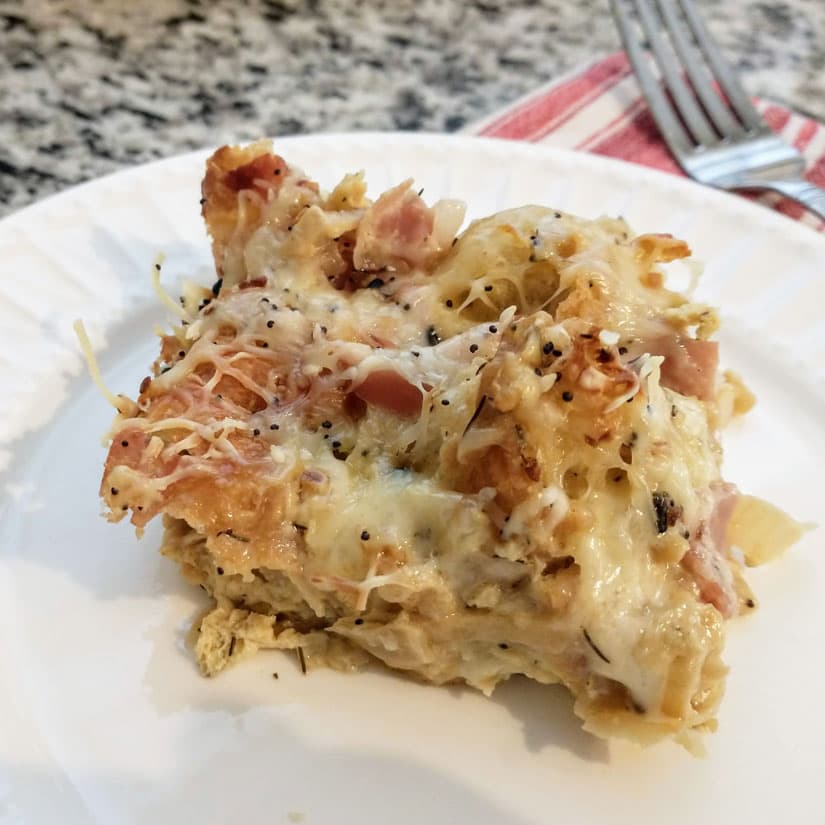 Croissant Breakfast Casserole with Caramelized Onion, Prosciutto, Brie, & Swiss